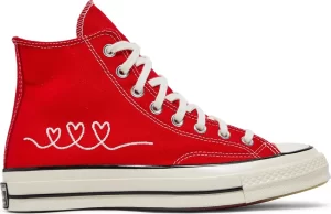The Converse Chuck 70 High is an iconic sneaker. Regardless of colorway, this is one of those shoes that you must have in your collection. Subsequently, the same can be said of the University Red “V-Day” model, below. This is a shoe that contains a nice red canvas upper with three hearts joined together near the bottom. Overall, this is an aesthetic that works great, and is currently available in numerous sizes for $774 USD. Adidas Stan Smith ‘Valentine’s Day’