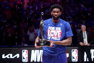 Joel Embiid Biography, Family, Career, and Net Worth 2023. The rhythmic journey of Joel Embiid, NBA superstar, charts a concerto of success, from his humble beginnings to his major success.